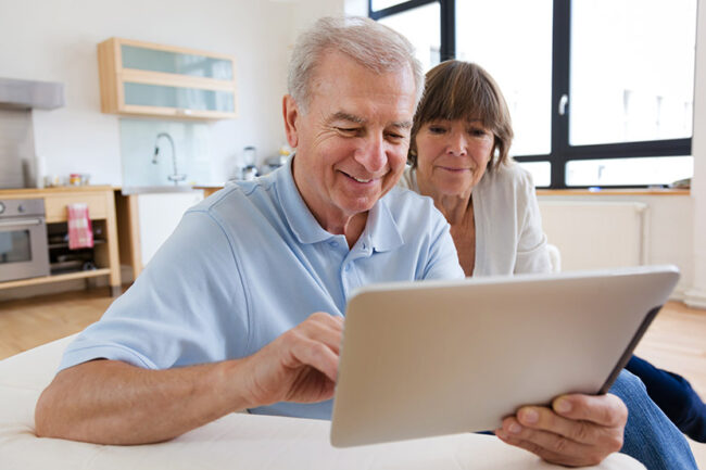 Senior couple with tablet computer