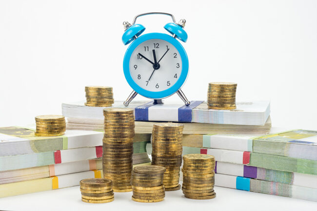 Hours cost on a pack of notes, around there are stacks of coins