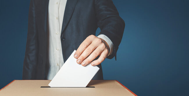 Man Voiter Putting Ballot Into Voting box. Democracy Freedom Concept