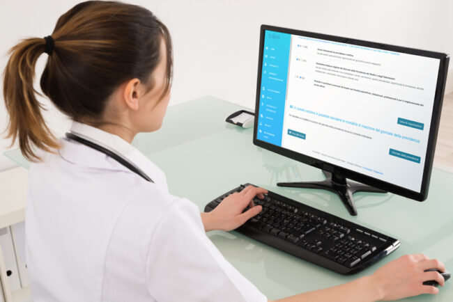 Female Doctor Video Conferencing On Digital Tablet